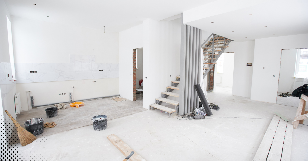 Office or residential space undergoing renovation with exposed stairs and construction materials.