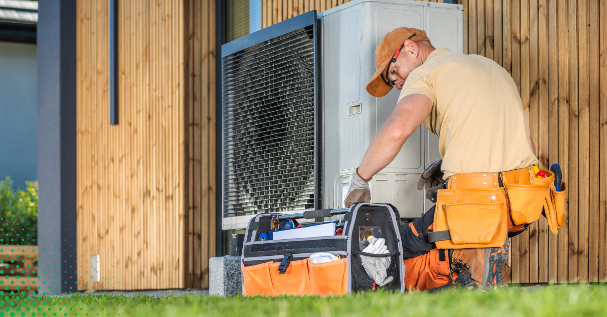 HVAC technician performing outdoor unit maintenance.