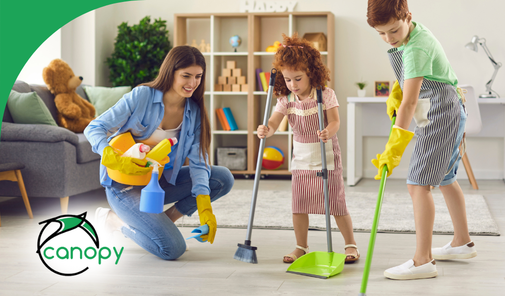 Happy family cleaning their living room together, teaching kids the importance of a tidy home.