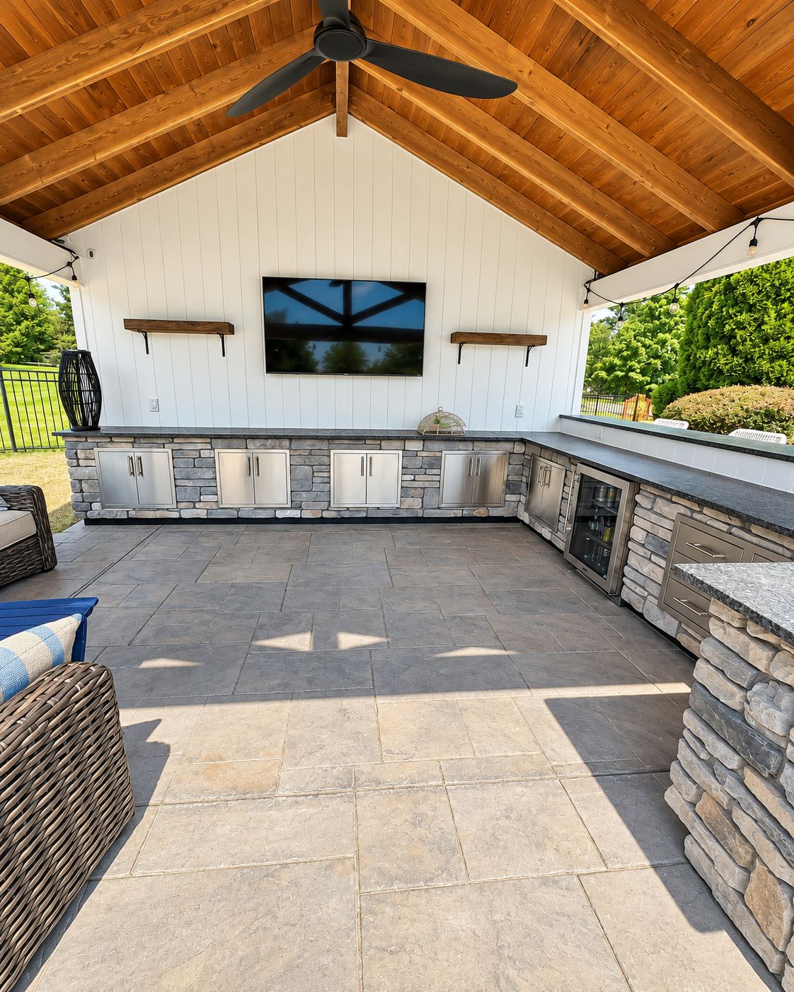 Custom shiplap feature wall and barn-beam shelf in outdoor pavilion by Canopy Building Services